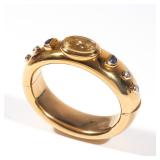 Lot 110  |  CITRINE, SAPPHIRE, DIAMOND & 18K GOLD BANGLE  |  20th century, having a central bezel se