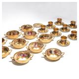 porcelain dinnerware decorated with raised gilt and hand-painted with various scenes from Wagner