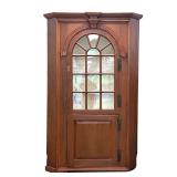 Lot 155  |  18TH CENTURY AMERICAN BARREL BACK CORNER CUPBOARD  |  Arched glazed door, over a lower p
