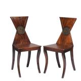 Lot 162  |  PAIR REGENCY HALL CHAIRS  |  With triangular hourglass backrests, each with a painted pl