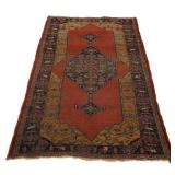 Lot 171  |  PERSIAN MEDALLION LONG RUG  |  Early 20th century, having a central medallion on a red g