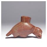 Lot 175  |  NATIVE AMERICAN CARVED BIRD PIPE BOWL  |  The red Catlinite pipe bowl in the form of a b