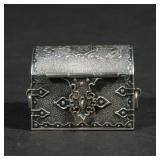 Lot 193  |  MINIATURE STERLING SILVER ARMORIAL CASKET  |  Small cloth-lined casket with armorial dec