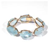 Lot 217  |  UNTREATED AQUAMARINE & 14K BRACELET  |  Designed as six amorphous aquamarine links on a 