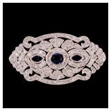 Lot 220  |  SAPPHIRE & DIAMOND 18K WHITE GOLD PIN  |  Having three faceted sapphires set in a diamon