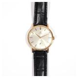 Lot 227  |  OMEGA CENTURY 18K GOLD CASE WRISTWATCH  |  Silver dial with gold baton numerals, alpha h