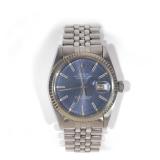 Lot 231  |  ROLEX OYSTER PERPETUAL DATEJUST  |  Steel case with a white gold fluted bezel, blue dial