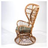 Lot 363  |  "EMMANUELLE" WICKER PEACOCK CHAIR  |  With a later green upholstered cushion h. 47 w. 28