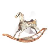 Lot 400 |  LARGE CARVED ROCKING HORSE  |  A turn of the century carved fruitwood horse with bobbed t