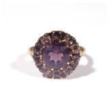 Lot 443  |  ANTIQUE AMETHYST & GOLD RING  |  Having a round mixed cut amethyst surrounded by smaller