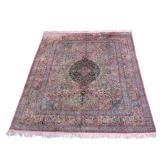 MID 20TH C. OR EARLIER PERSIAN SILK CARPET | Medallion surrounded by tree of life pattern with birds