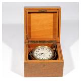 RARE PATEK PHILIPPE CHRONOMETER | A gimbal mounted naval chronometer in brass, with silvered enamel 