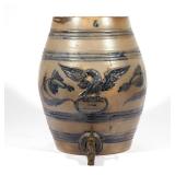 AMERICAN BLUE GLAZED STONEWARE CISTERN | 19th century, with bas relief eagle and metal tap h. 15-1/2