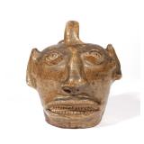 AMERICAN STONEWARE FACE JUG (UGLY JUG) | Probably 19th, alkaline glaze h. 7 1/2 in. (over handle) w.