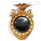 AMERICAN OR ENGLISH GILT CONVEX MIRROR | Early-mid 19th century, crested by an eagle h. 30 w. 19 d. 