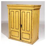 19TH C. AMERICAN FOLK ART YELLOW TABLE CABINET | Yellow painted table cabinet having black panel out