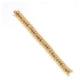 14K FRENCH GOLD & GEMSTONE BRACELET | With chevron link design, inset with various precious stones, 