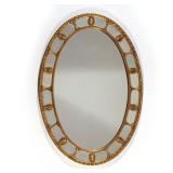 19TH CENTURY OVAL CARVED WALL MIRROR | Gilt frame mirror with border panels separated by carved Anth