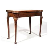 QUEEN ANNE WALNUT TURRET CORNER GAMES TABLE | 18th century, appears to retain original baize writing