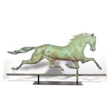 LATE 19TH C. RUNNING HORSE WEATHERVANE | Full-bodied, leaded head. h. 17 w. 41 in. (horse only) over