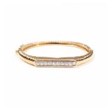 DIAMOND & 18K GOLD HARD BRACELET | Of stepped band design, with 10 small full cut diamonds, ea. appr