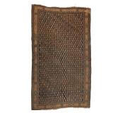 NORTHWEST PERSIAN CARPET | Early 20th century, having an all-over boteh pattern on an indigo ground.