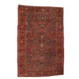ANTIQUE SAROUK RUG | Circa 1920s, with blooming palmette designs on a red ground surrounded by indig