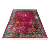 CHINESE ART DECO ‘NICHOLS’ CARPET | Mid-20th century, with vase and flower design on a burgundy grou