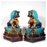 PAIR CHINESE GLAZED CERAMIC FOO DOGS | 20th century, Fahua-style glazed ceramic foo lions, on separa