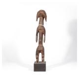 MUMUYE HUMANOID FIGURE | Carved wood, standing on a plinth. h. 27 w. 6 d. 5-1/4 in.
