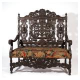 ANGLO-INDIAN CARVED SETTEE | Late 19th / early 20th century, with period hand-woven needlepoint seat