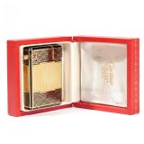 CARTIER PARIS ENAMELED CIGARETTE LIGHTER | Textured metal with black enamel design, signed "Cartier,