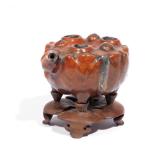 CHINESE GLAZED FIGURAL WATER DROPPER | 19th century or earlier, porcelain with red glaze, in the for