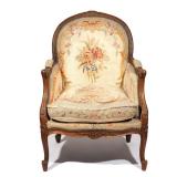 LOUIS XV-STYLE NEEDLEWORK BERGERE | 19th century, oak-carved frame with floral needlework upholstery