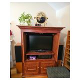 House Plant, Wooden Entertainment Center, TV, Speakers