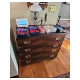 wooden dresser, electric oil style lamp, box of taper candles