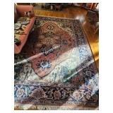 Very large Oriental fringed rug with pinks, blues