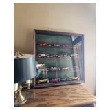 Die cast cars in case, table lamp