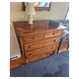 Wood dresser, wooden chest of draws, table lamp