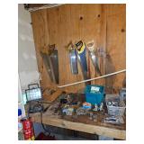 Assorted hand saws, work light, stapler, assorted tools