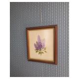 Wooden framed art work of purple flowers