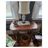 Vintage table, lamp with pink flowers, round woven basket, doll and carriage, doilies