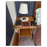 Wooden side table, lamp, doily, Machinery’s handbook