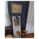Long mirror, framed artwork, round basket, chair with bible