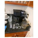 Keurig duo machine, stemmed glasses, salt dishes