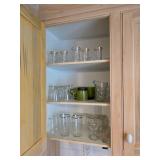 Assorted drinking glasses, green mug, glass creamer