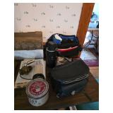 Thermos, camera bag, drinking glasses, old coffee can