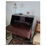 Fold down mahogany secretary desk, Eastlake Victorian parlor chair, Desk lamp