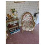 Wicker chair with pad, books, small bookshelf, welcome sign, Star Wars toy