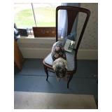 Wooden chair with blue chair pads, Fabric cat leaping